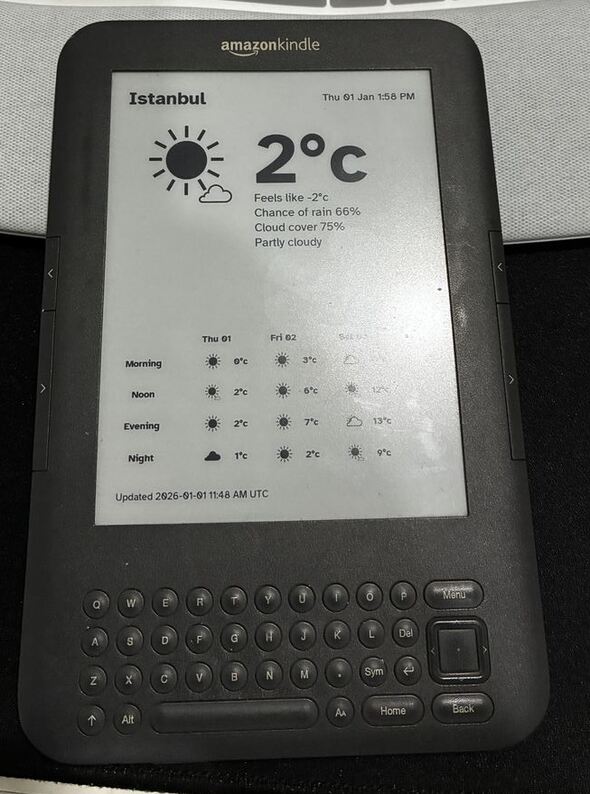 Kindle 3 keyboard showing the weather in my area